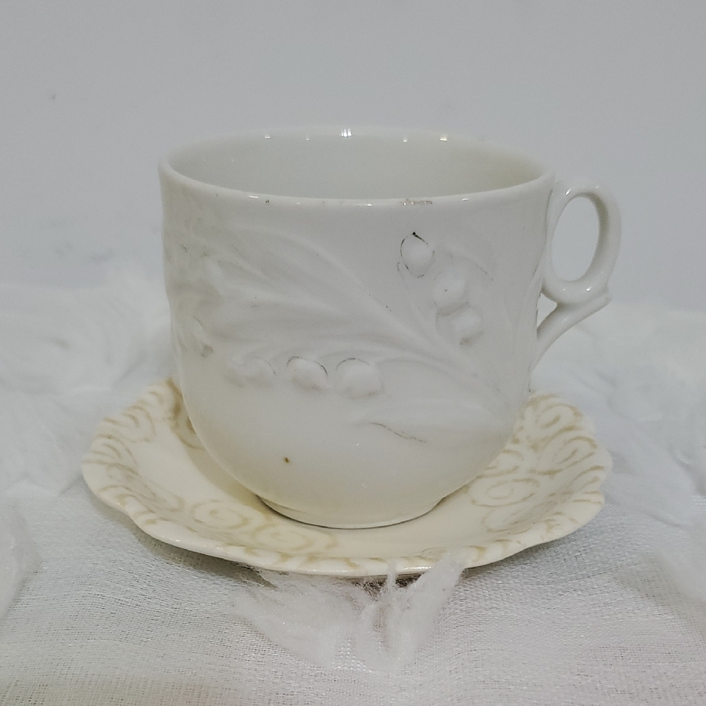 Elegant White Embossed Teacup and Saucer Set